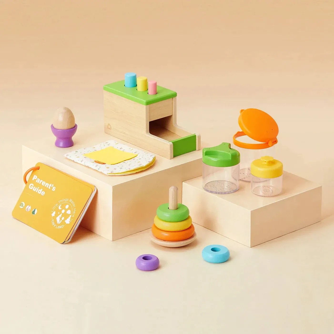 Tiny Land Montessori Toy Set for Babies 1 Year Old Thinker Play Kit- 5-in-1 Wooden Learning Toys with Peg Drop Box, Rocking Stacker, Egg Cup, Canister Set, and Crinkle Bag